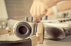 dj music producer turning knob his studio equipment