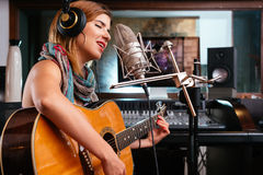 woman recording studio acoustic guitar microfone condenser